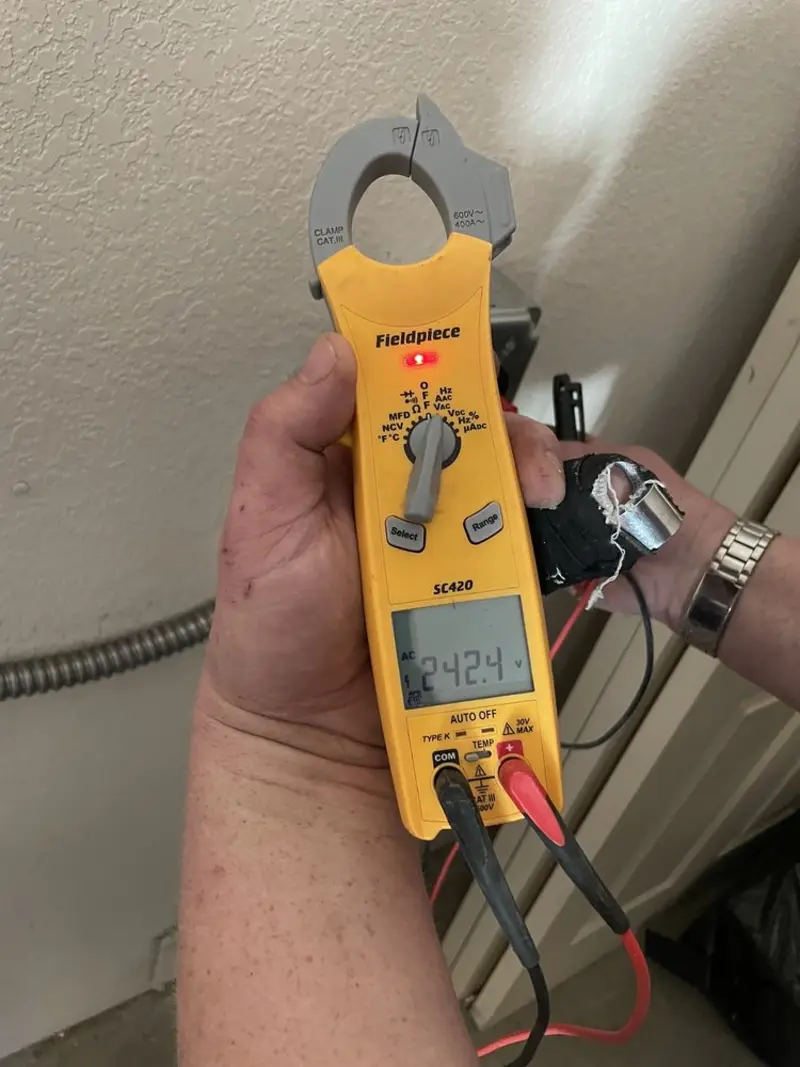 Voltage testing with clamp meter during Electrical Installation Services in Dunbarton